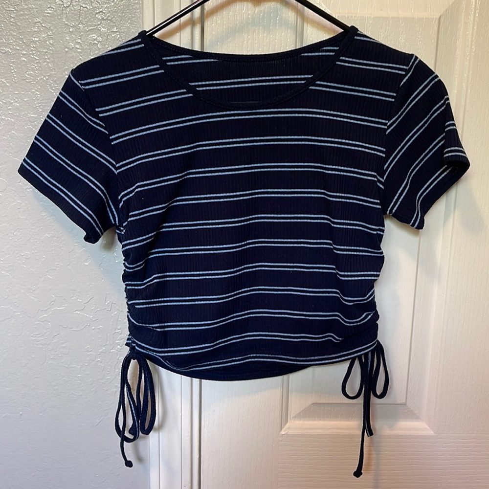 Blue striped shirt with tie sides